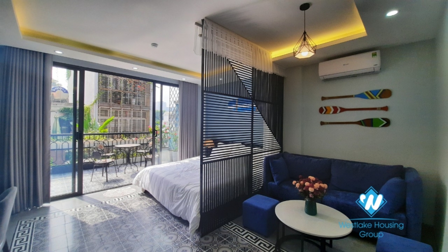 Nice furnished apartment with big balcony for rent in Hoan Kiem.