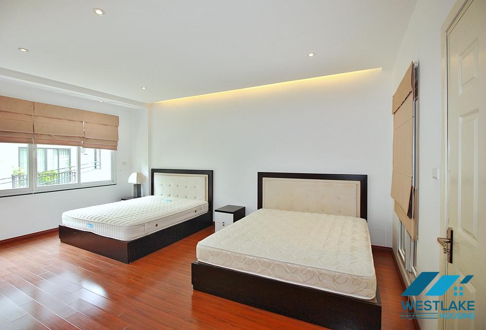 Semi-furnished 4 bedrooms house with big yard for rent in Tay Ho ward, Ha Noi